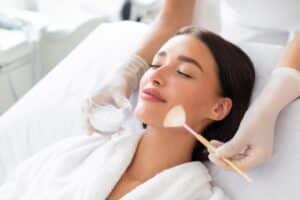 Close-up of a woman during a chemical peel treatment, offered at NorCal Dermatology Group in Berkeley, CA